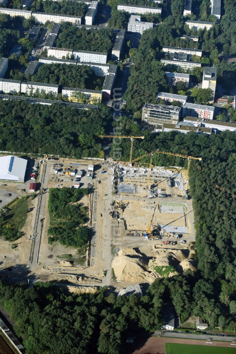 Aerial photograph Potsdam - Construction site to build a new multi-family residential complex at Heinrich-Mann-Avenue in the district Waldstadt I in Potsdam in the state Brandenburg. Involved company is Heinrich-Mann-Allee 95 Grundstuecksgesellschaft mbH