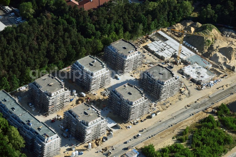 Potsdam from the bird's eye view: Construction site to build a new multi-family residential complex at Heinrich-Mann-Avenue in the district Waldstadt I in Potsdam in the state Brandenburg. Involved company is Heinrich-Mann-Allee 95 Grundstuecksgesellschaft mbH