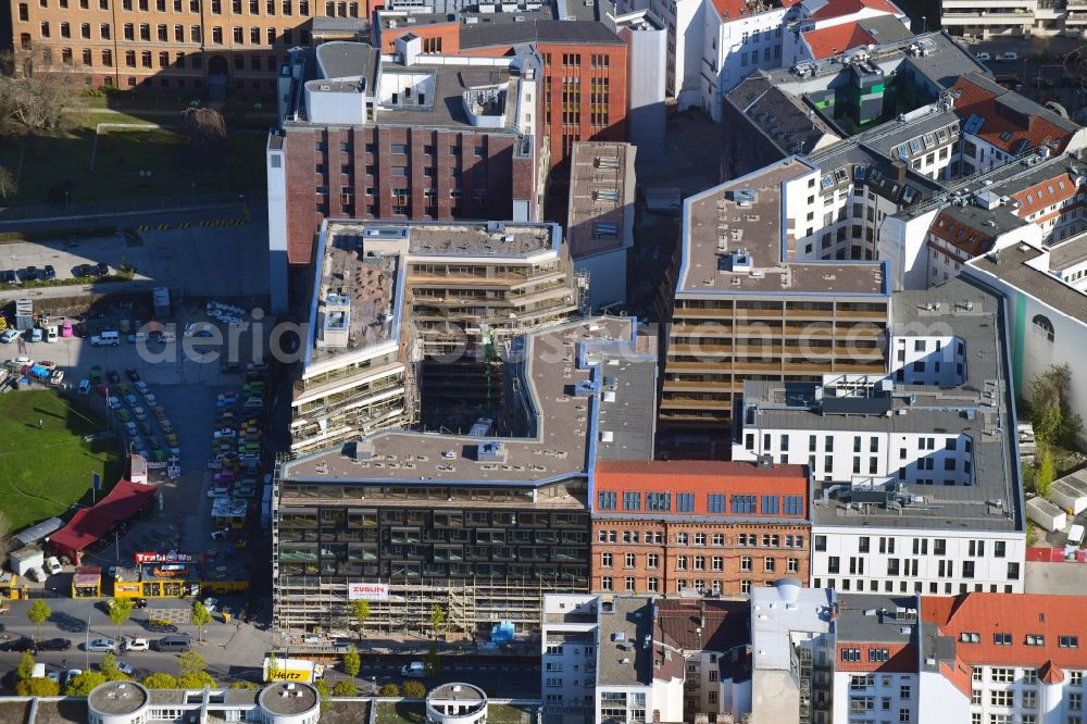 Berlin from the bird's eye view: Construction site to build a new multi-family residential complex Charlie Livin of Trockland Management GmbH along the Zimmerstrasse and Mauerstrasse in the district Mitte in Berlin, Germany