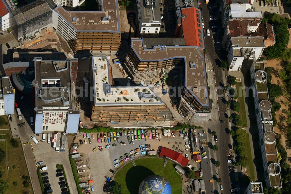 Berlin from the bird's eye view: Construction site to build a new multi-family residential complex Charlie Livin of Trockland Management GmbH along the Zimmerstrasse and Mauerstrasse in the district Mitte in Berlin, Germany