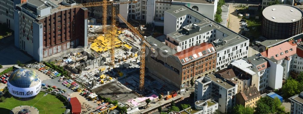 Berlin from the bird's eye view: Construction site to build a new multi-family residential complex Charlie Livin of Trockland Management GmbH along the Zimmerstrasse and Mauerstrasse in the district Mitte in Berlin, Germany