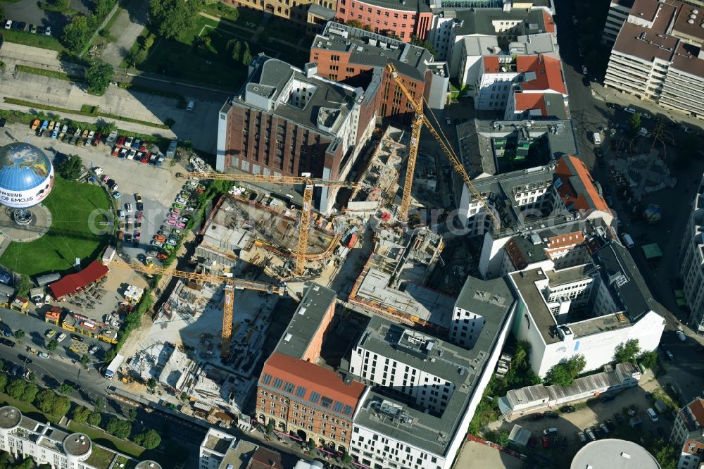 Berlin from the bird's eye view: Construction site to build a new multi-family residential complex Charlie Livin of Trockland Management GmbH along the Zimmerstrasse and Mauerstrasse in the district Mitte in Berlin, Germany