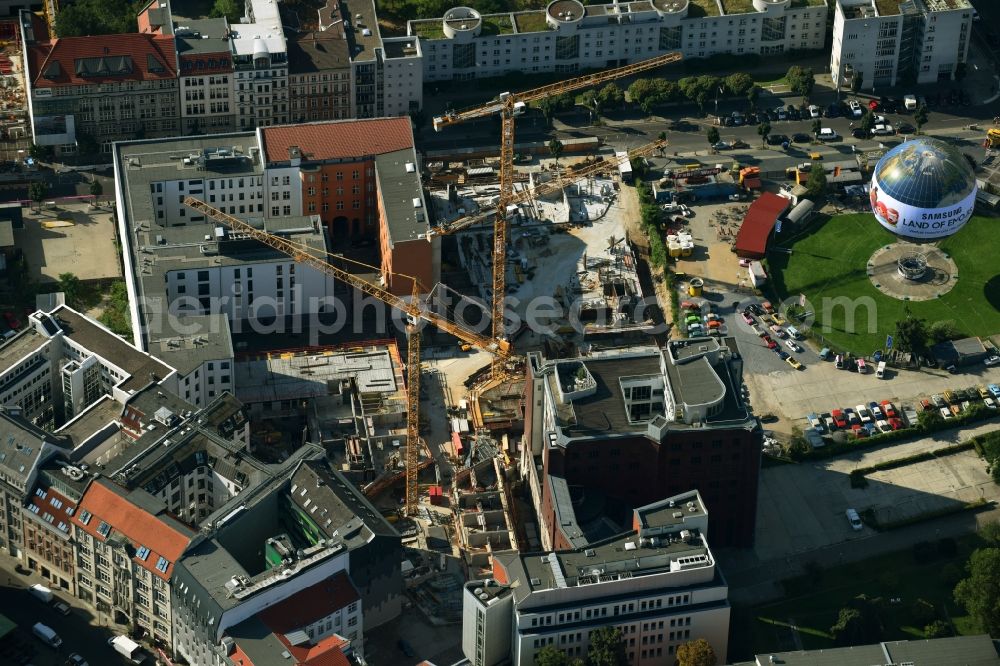 Berlin from the bird's eye view: Construction site to build a new multi-family residential complex Charlie Livin of Trockland Management GmbH along the Zimmerstrasse and Mauerstrasse in the district Mitte in Berlin, Germany