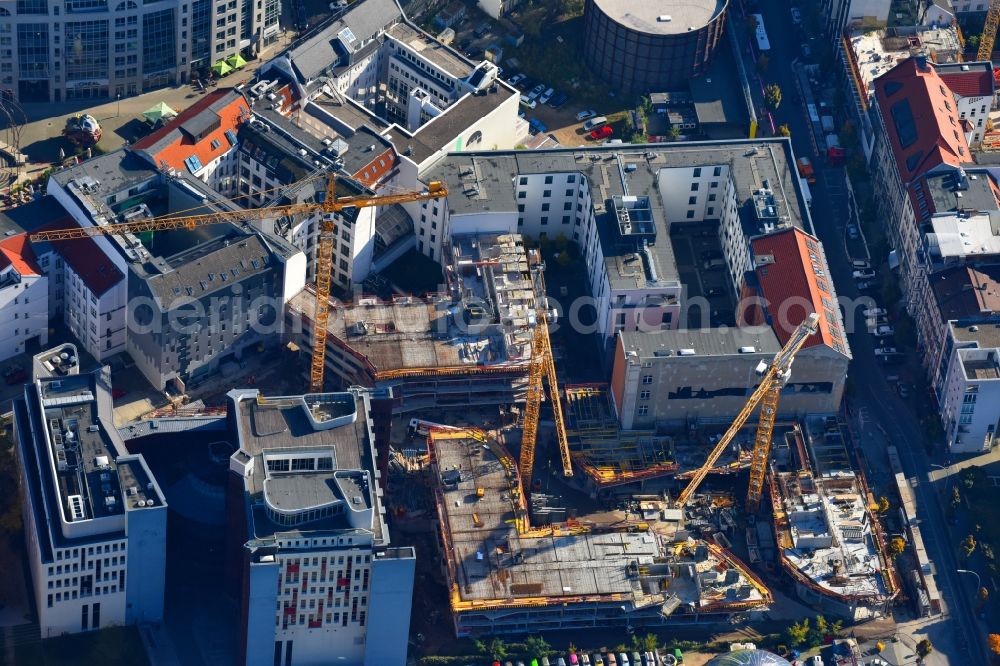 Berlin from the bird's eye view: Construction site to build a new multi-family residential complex Charlie Livin of Trockland Management GmbH along the Zimmerstrasse and Mauerstrasse in the district Mitte in Berlin, Germany