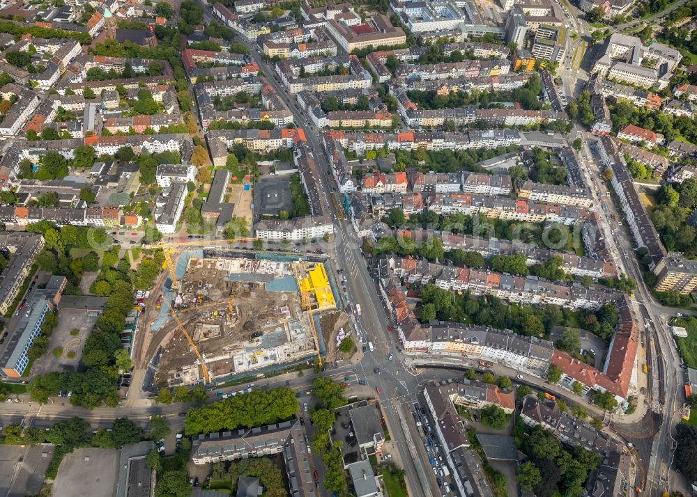 Essen from the bird's eye view: Construction site to build a new multi-family residential complex a?? Cranachhoefe a?? of Allbau AG in Essen in the state North Rhine-Westphalia, Germany