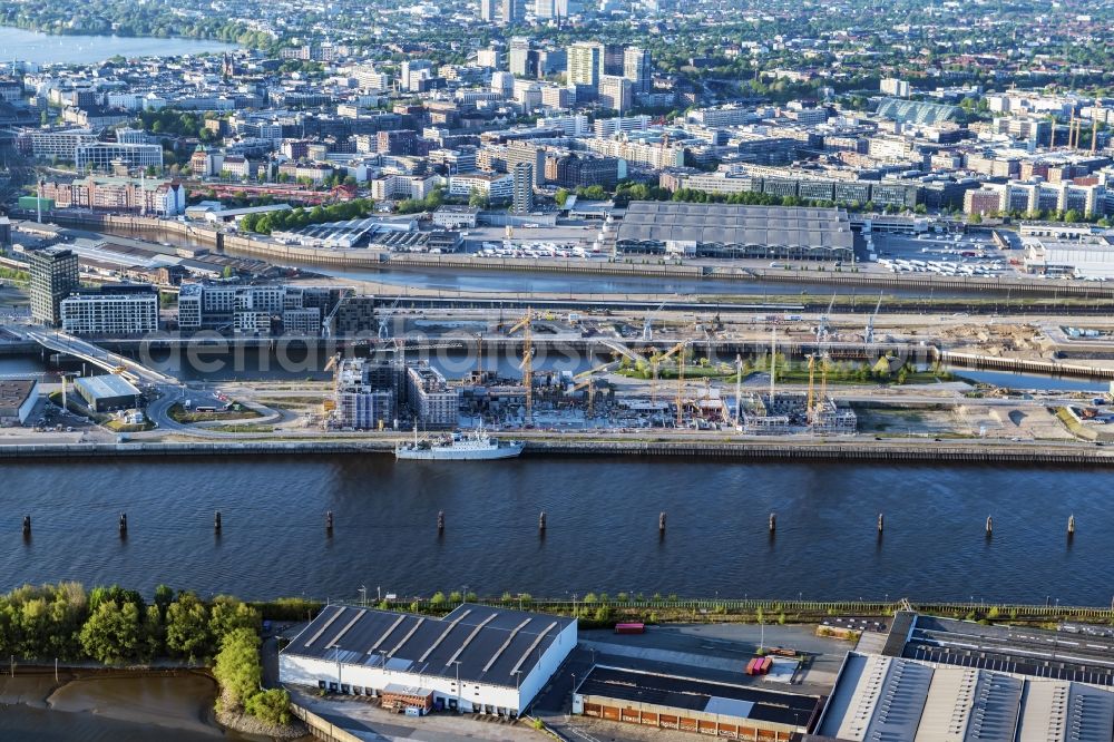 Hamburg from the bird's eye view: Construction site to build a new multi-family residential complex of DC DEVELOPMENTS GMBH & CO. KG on Strandkai in the district HafenCity in Hamburg, Germany