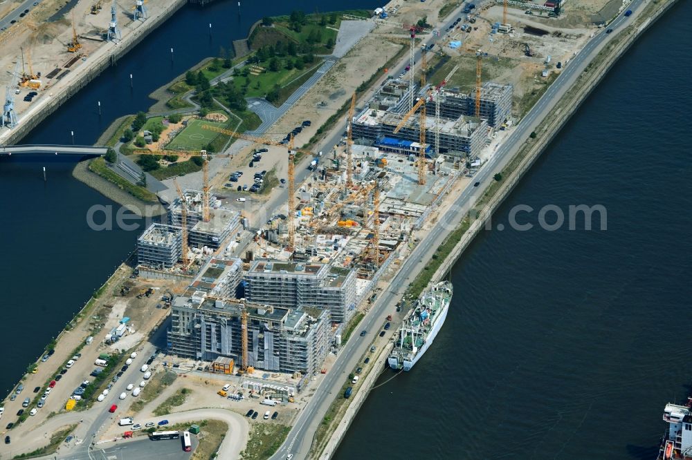 Hamburg from above - Construction site to build a new multi-family residential complex of DC DEVELOPMENTS GMBH & CO. KG on Strandkai in the district HafenCity in Hamburg, Germany