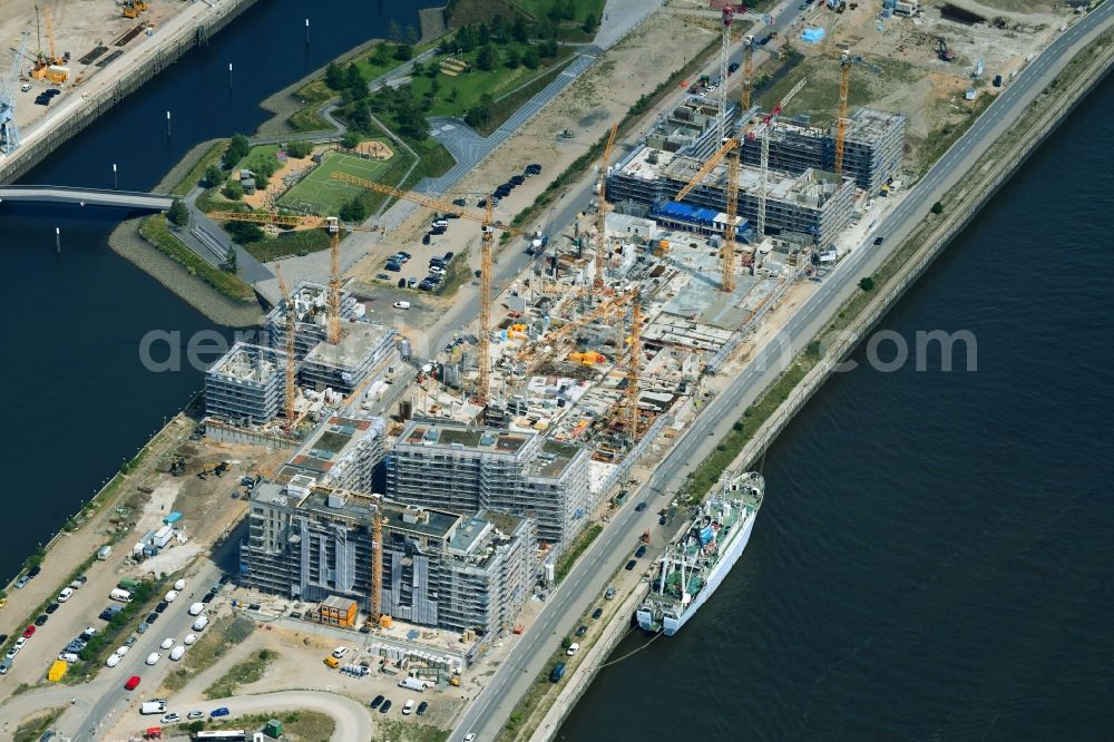 Hamburg from the bird's eye view: Construction site to build a new multi-family residential complex of DC DEVELOPMENTS GMBH & CO. KG on Strandkai in the district HafenCity in Hamburg, Germany