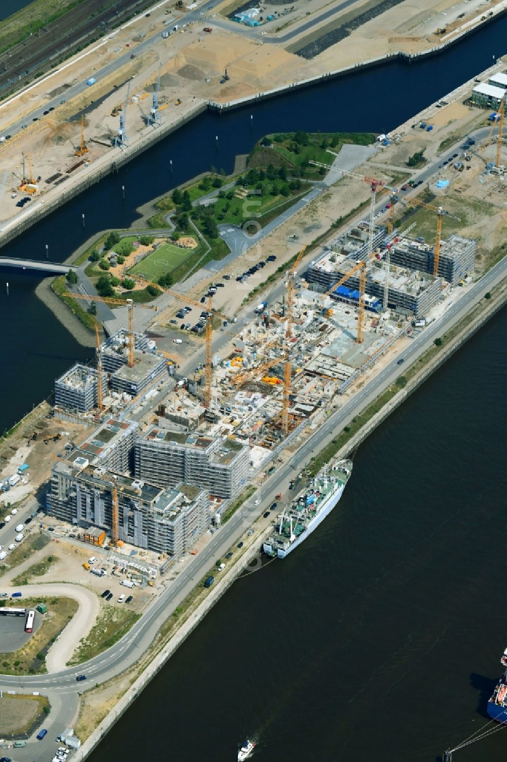 Hamburg from the bird's eye view: Construction site to build a new multi-family residential complex of DC DEVELOPMENTS GMBH & CO. KG on Strandkai in the district HafenCity in Hamburg, Germany