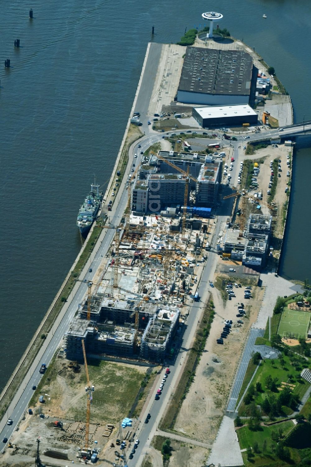 Hamburg from the bird's eye view: Construction site to build a new multi-family residential complex of DC DEVELOPMENTS GMBH & CO. KG on Strandkai in the district HafenCity in Hamburg, Germany