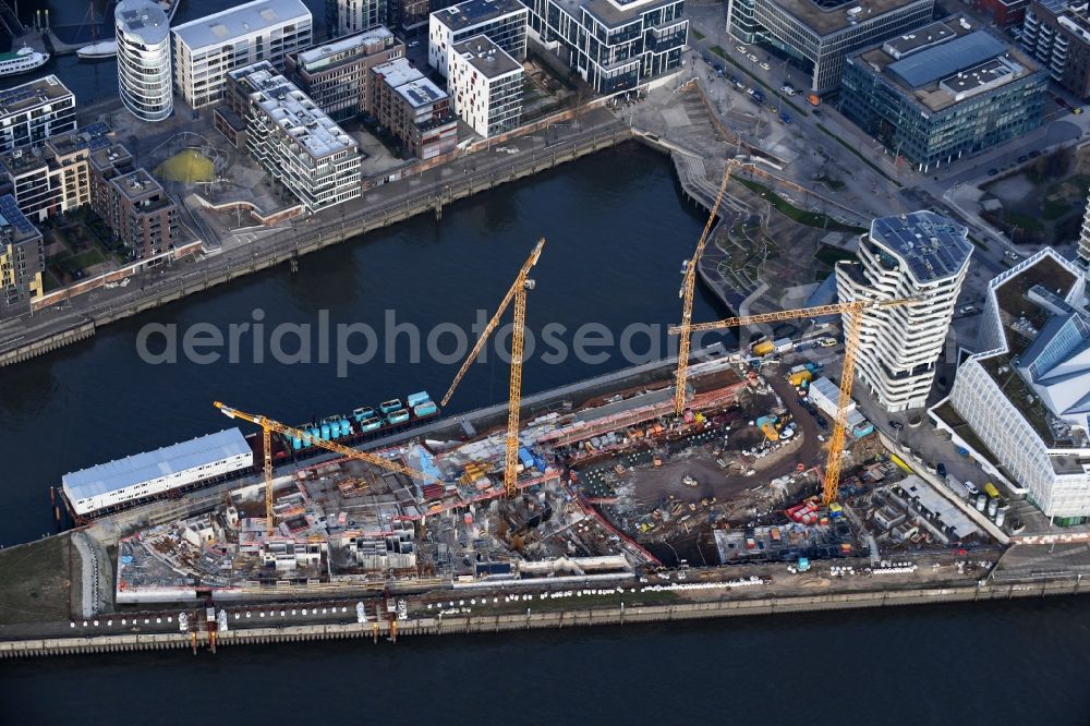 Hamburg from the bird's eye view: Construction site to build a new multi-family residential complex of DC DEVELOPMENTS GMBH & CO. KG on Strandkai in the district HafenCity in Hamburg, Germany