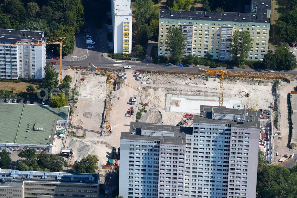 Berlin from the bird's eye view: Construction site to build a new multi-family residential complex Dolgensee-Center on Dolgenseestrasse in the district Lichtenberg in Berlin, Germany