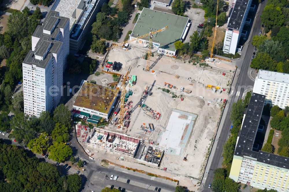 Berlin from the bird's eye view: Construction site to build a new multi-family residential complex Dolgensee-Center on Dolgenseestrasse in the district Lichtenberg in Berlin, Germany