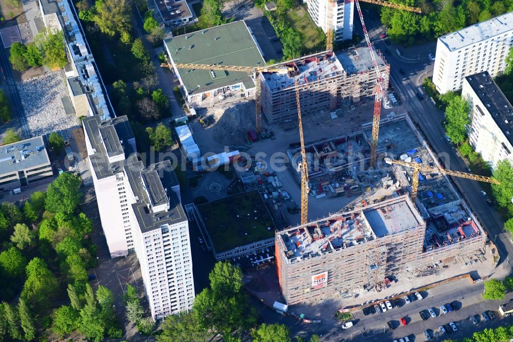 Berlin from the bird's eye view: Construction site to build a new multi-family residential complex Dolgensee-Center on Dolgenseestrasse in the district Lichtenberg in Berlin, Germany