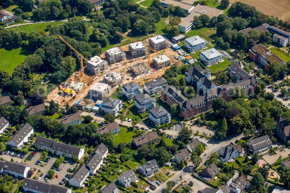 Aerial image Düsseldorf - Construction site to build a new multi-family residential complex at a terrain formerly owned by the Graf-Recke-foundation at Bergesway in the district Wittlaer in Duesseldorf in the state North Rhine-Westphalia The project is managed by the CORPUS SIREO Projektentwicklung Wohnen GmbH