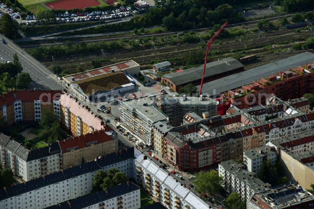 Berlin from the bird's eye view: Construction site to build a new multi-family residential complex Dudenstrasse in the district Tempelhof-Schoeneberg in Berlin, Germany