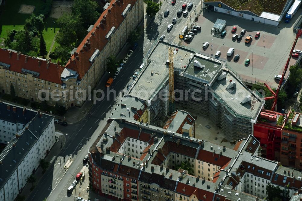 Berlin from the bird's eye view: Construction site to build a new multi-family residential complex Dudenstrasse in the district Tempelhof-Schoeneberg in Berlin, Germany