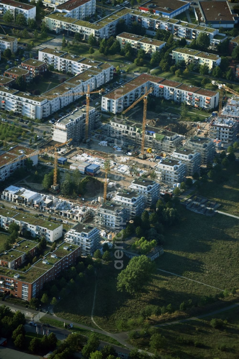 Berlin from the bird's eye view: Construction site to build a new multi-family residential complex Eisenacher Strasse - Hasenholzer Allee - Krummenseer Strasse in Berlin