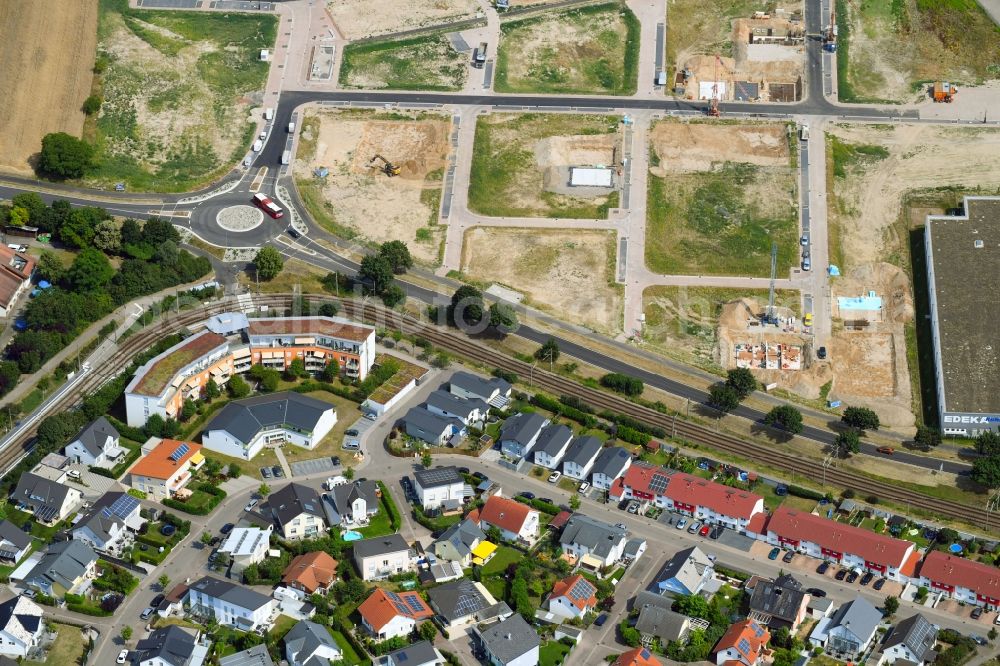 Linkenheim-Hochstetten from above - Construction site to build a new multi-family residential complex along the Alten Landstrasse in Linkenheim-Hochstetten in the state Baden-Wurttemberg, Germany