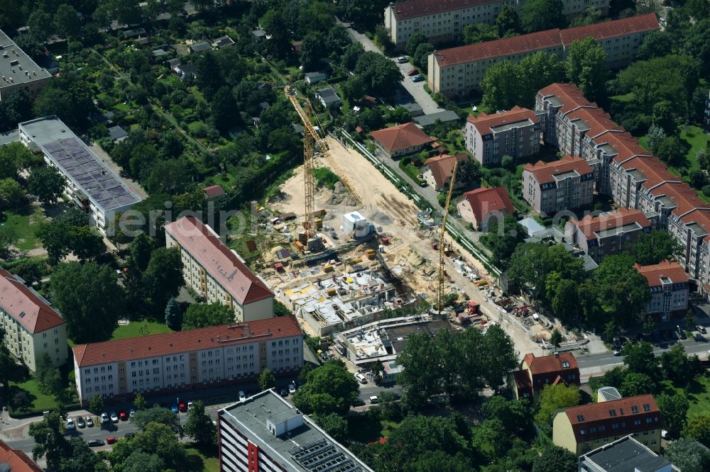 Berlin from the bird's eye view: Construction site to build a new multi-family residential complex along the Einbecker Strasse in Berlin, Germany