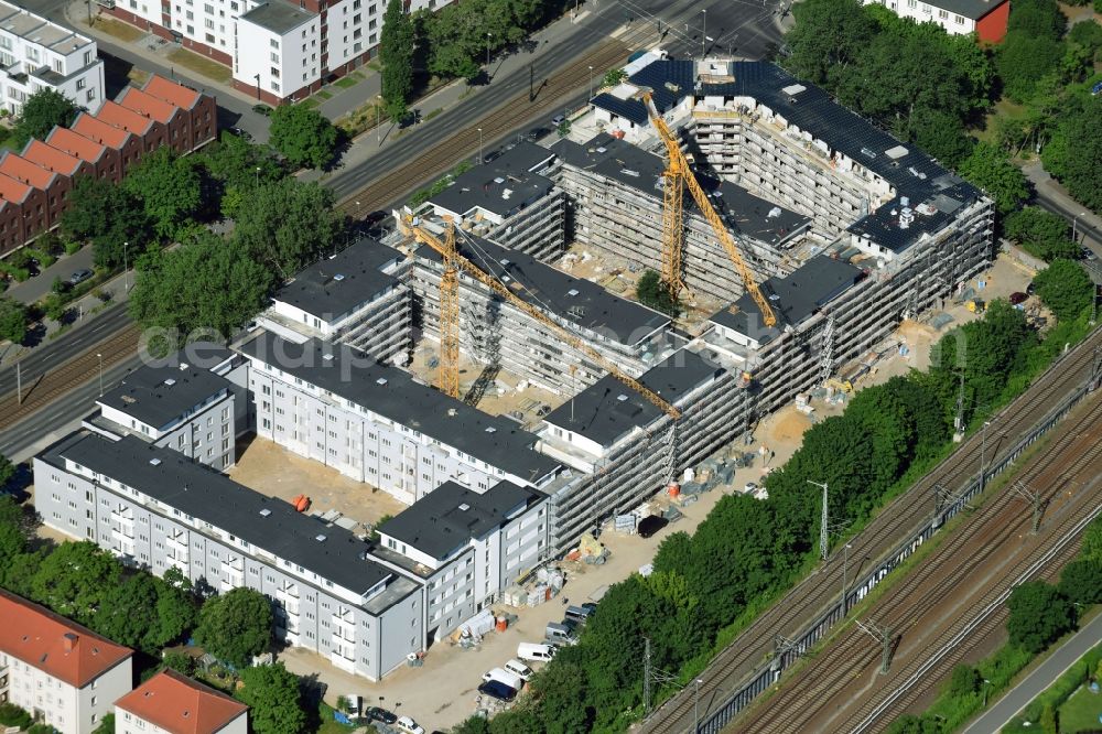 Berlin from the bird's eye view: Construction site to build a new multi-family residential complex along the Hauptstrasse on Rummelsburger Bucht in Rummelsburg in Berlin, Germany