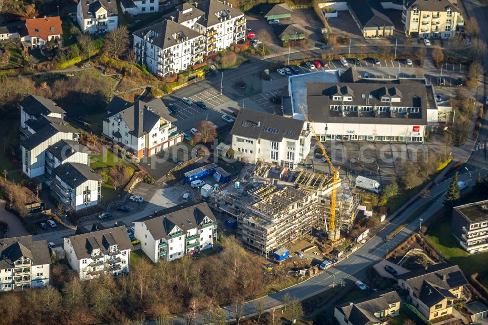 Aerial image Finnentrop - Construction site to build a new multi-family residential complex of Sparkasse Finnentrop on Serkenroof Strasse in Finnentrop in the state North Rhine-Westphalia, Germany