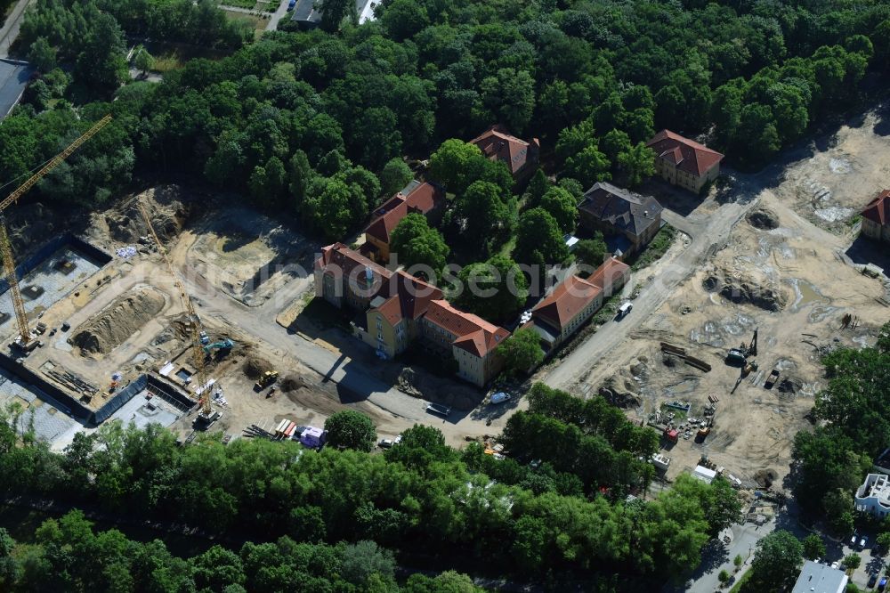 Berlin from the bird's eye view: Construction site for the construction of a multi-family house residential complex on the grounds of the former Kinderklinik Lindenhof on the Gotlindestrasse in the district of Lichtenberg in Berlin, Germany