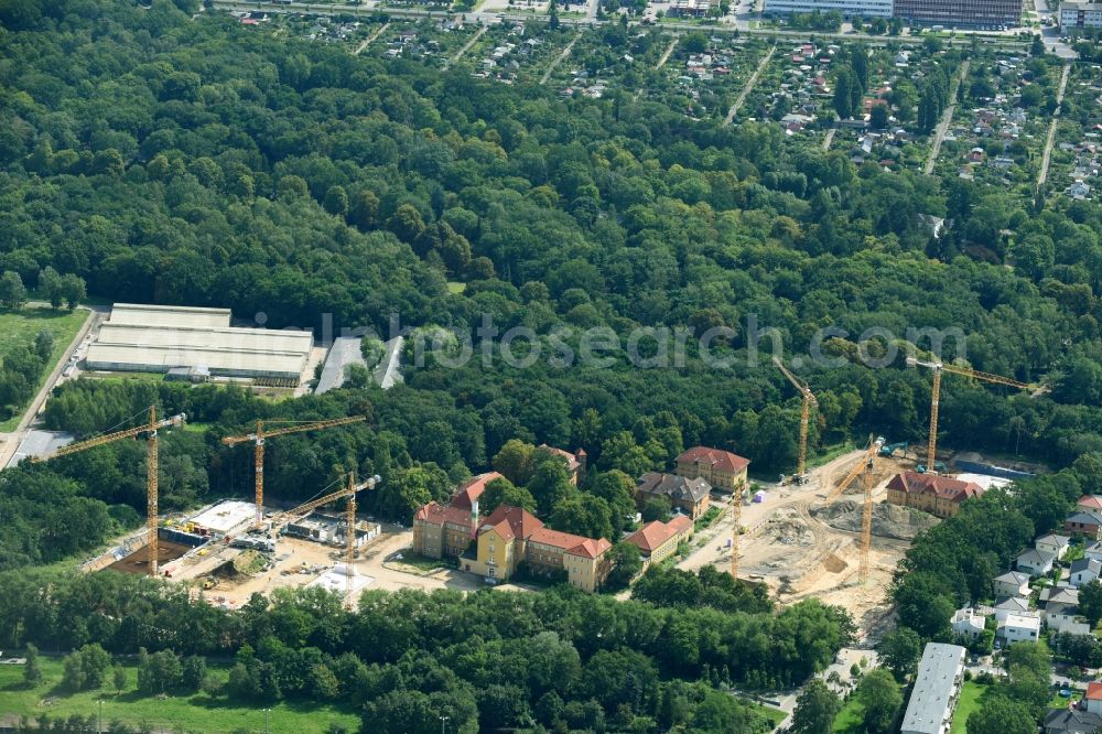 Berlin from the bird's eye view: Construction site for the construction of a multi-family house residential complex on the grounds of the former Kinderklinik Lindenhof on the Gotlindestrasse in the district of Lichtenberg in Berlin, Germany