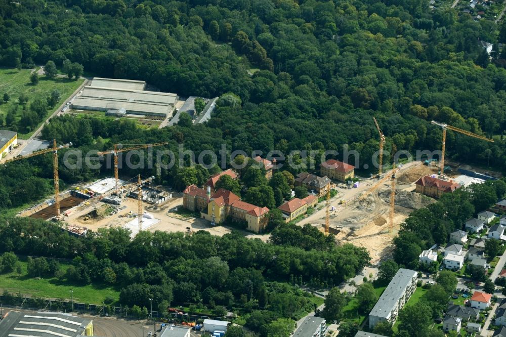 Berlin from the bird's eye view: Construction site for the construction of a multi-family house residential complex on the grounds of the former Kinderklinik Lindenhof on the Gotlindestrasse in the district of Lichtenberg in Berlin, Germany