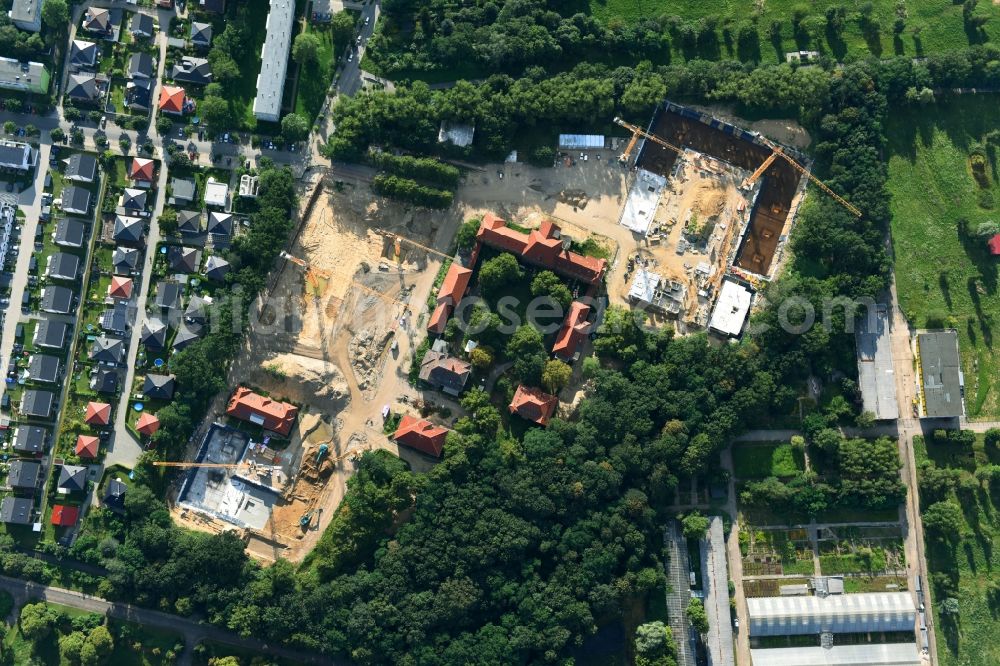 Berlin from the bird's eye view: Construction site for the construction of a multi-family house residential complex on the grounds of the former Kinderklinik Lindenhof on the Gotlindestrasse in the district of Lichtenberg in Berlin, Germany