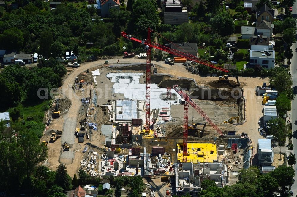 Berlin from the bird's eye view: Construction site to build a new multi-family residential complex Germanenstrasse - Gruenauer Strasse in the district Altglienicke in Berlin, Germany