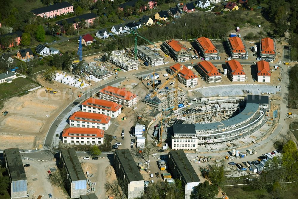 Wustermark from the bird's eye view: Construction site to build a new multi-family residential complex Gold- Gartenstadt Olympisches Dorf von 1936 in the district Elstal in Wustermark in the state Brandenburg, Germany