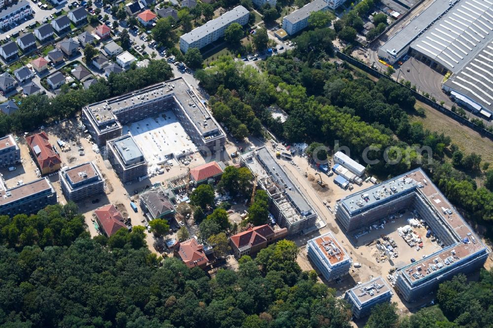 Berlin from the bird's eye view: Construction site for the construction of a multi-family house residential complex on the grounds of the former Kinderklinik Lindenhof on the Gotlindestrasse in the district of Lichtenberg in Berlin, Germany