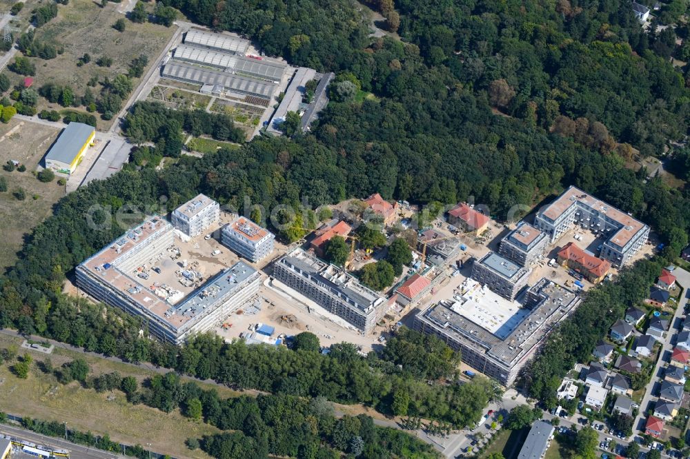 Berlin from the bird's eye view: Construction site for the construction of a multi-family house residential complex on the grounds of the former Kinderklinik Lindenhof on the Gotlindestrasse in the district of Lichtenberg in Berlin, Germany