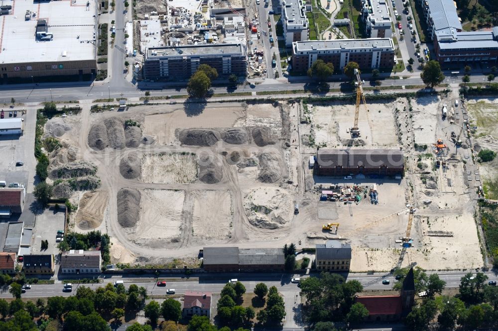 Berlin from the bird's eye view: Construction site to build a new multi-family residential complex of Gut Alt-Biesdorf on Weissenhoeher Strasse in Berlin, Germany