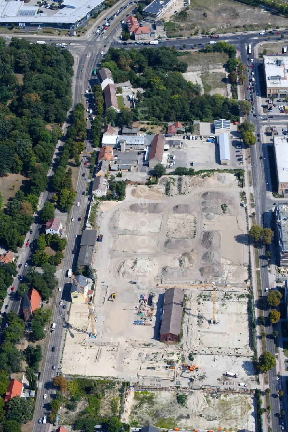 Berlin from the bird's eye view: Construction site to build a new multi-family residential complex of Gut Alt-Biesdorf on Weissenhoeher Strasse in Berlin, Germany