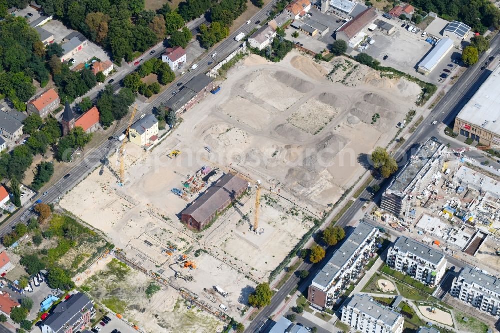 Berlin from the bird's eye view: Construction site to build a new multi-family residential complex of Gut Alt-Biesdorf on Weissenhoeher Strasse in Berlin, Germany