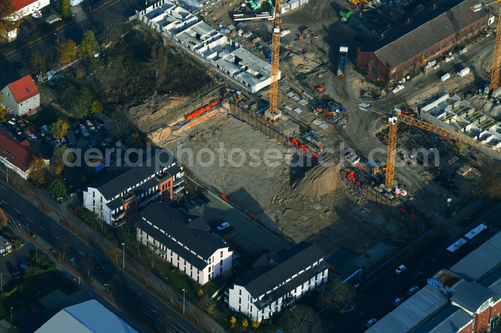 Berlin from the bird's eye view: Construction site to build a new multi-family residential complex of Gut Alt-Biesdorf on Weissenhoeher Strasse in Berlin, Germany