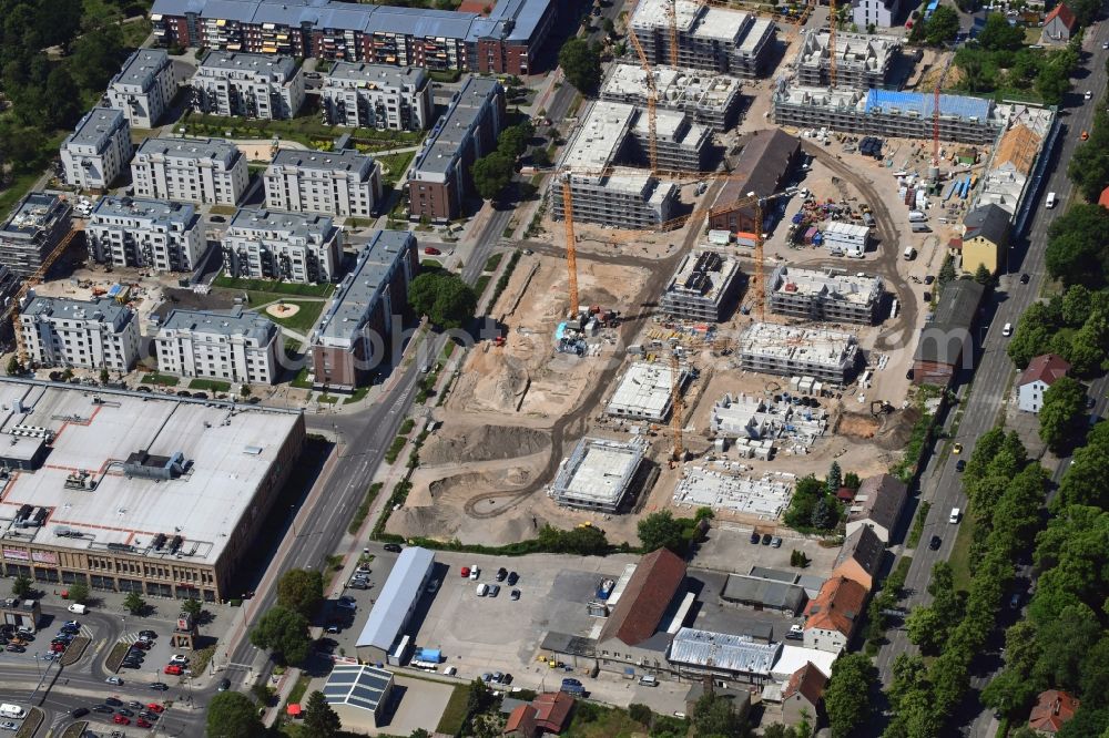 Berlin from the bird's eye view: Construction site to build a new multi-family residential complex of Gut Alt-Biesdorf on Weissenhoeher Strasse in Berlin, Germany