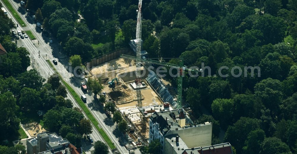 Berlin from the bird's eye view: Construction site to build a new multi-family residential complex on Hasenheide in the district Neukoelln in Berlin, Germany