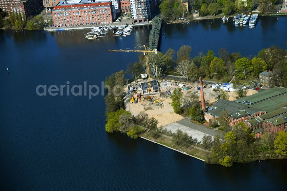 Aerial image Berlin - Construction site for the construction of an apartment building on the Havel island of Eiswerder in the district of Hakenfelde in Berlin, Germany