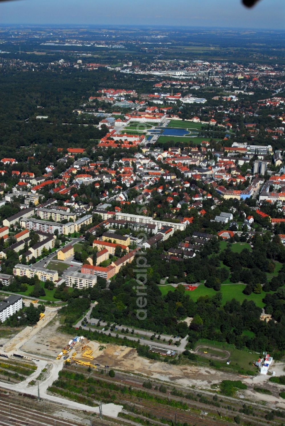 München from the bird's eye view: Construction site to build a new multi-family residential complex Am Hirschgarten in the district Neuhausen-Nymphenburg in Munich in the state Bavaria, Germany