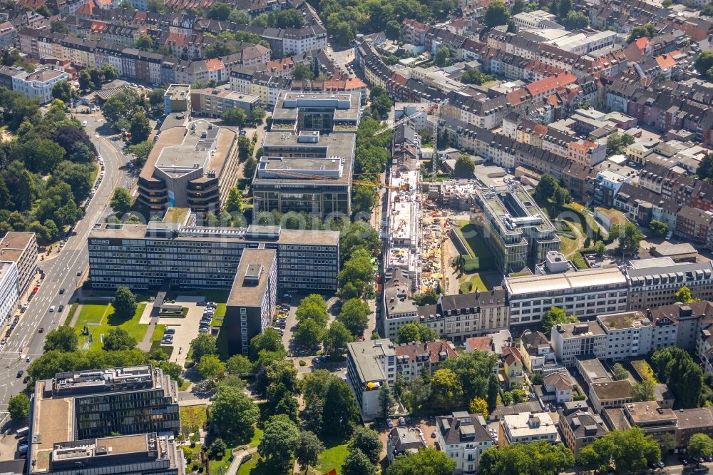 Essen from the bird's eye view: Construction site to build a new multi-family residential complex of HOPF Immobilien-Entwicklungs-GmbH & Co. KG on Baumstrasse in Essen in the state North Rhine-Westphalia, Germany