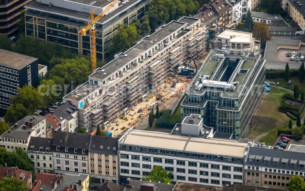 Essen from the bird's eye view: Construction site to build a new multi-family residential complex of HOPF Immobilien-Entwicklungs-GmbH & Co. KG on Baumstrasse in Essen in the state North Rhine-Westphalia, Germany