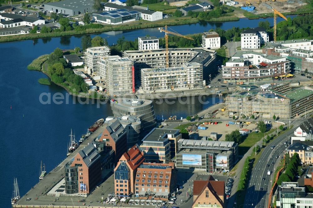 Rostock from the bird's eye view: Construction site to build a new multi-family residential complex Inselquartier on Gaffelschonerweg - Loggerweg in Rostock in the state Mecklenburg - Western Pomerania, Germany