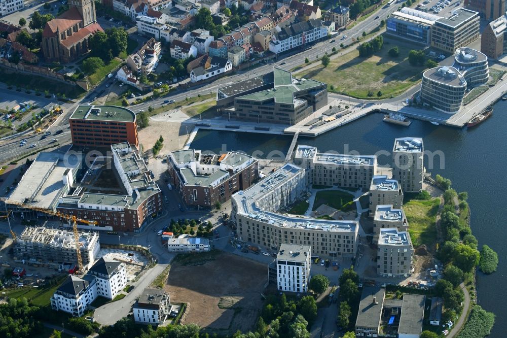 Aerial photograph Rostock - Construction site to build a new multi-family residential complex Inselquartier on Gaffelschonerweg - Loggerweg in Rostock in the state Mecklenburg - Western Pomerania, Germany