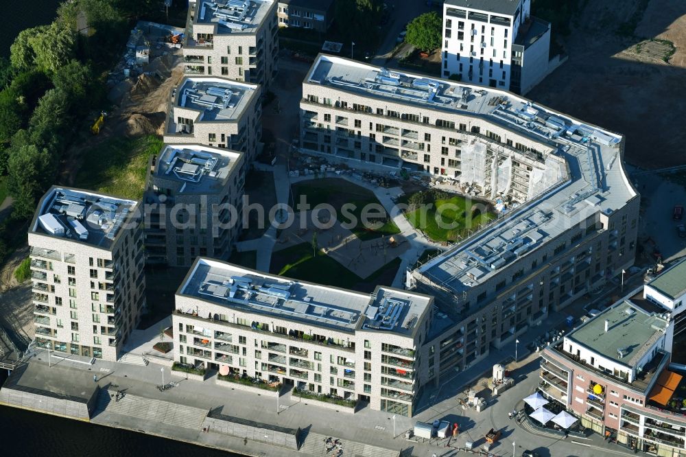 Rostock from the bird's eye view: Construction site to build a new multi-family residential complex Inselquartier on Gaffelschonerweg - Loggerweg in Rostock in the state Mecklenburg - Western Pomerania, Germany