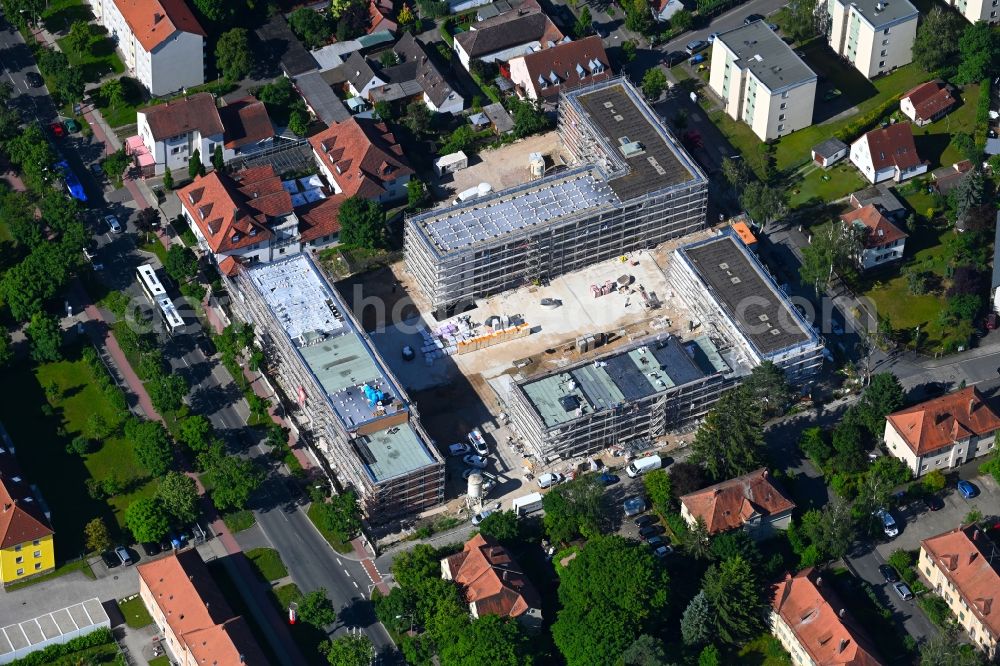 Erlangen from the bird's eye view: Construction site to build a new multi-family residential complex Johann-Juergen-Strasse, Mainstrasse and Aeusserer Brucker Strasse in the district Bruck in Erlangen in the state Bavaria, Germany