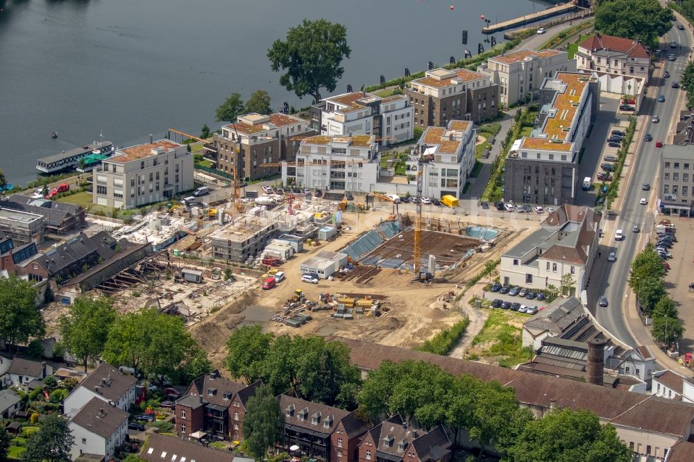 Essen from the bird's eye view: Construction site to build a new multi-family residential complex on Kettwiger Seepromenade in Essen in the state North Rhine-Westphalia