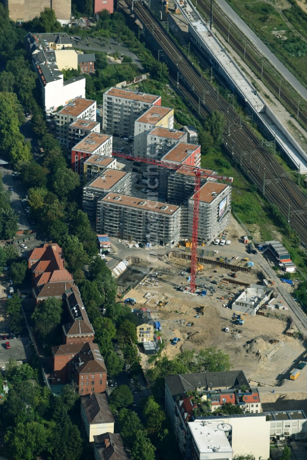 Berlin from above - Construction site to build a new multi-family residential complex Kruppstrasse - Lehrter Strasse in Berlin